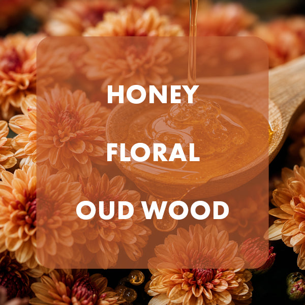 A square product graphic with the text 'HONEY FLORAL OUD WOOD' in white over a warm amber honey spoon, surrounded by orange flowers. 