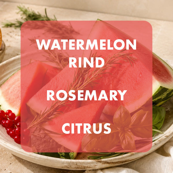 A close-up of sliced watermelon with visible red rind, garnished with rosemary sprigs and a currants, served in a bowl. A large translucent pink label overlay reads “WATERMELON RIND ROSEMARY CITRUS.